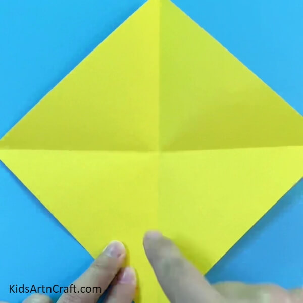 Making Marks on the Craft Paper by Slightly Folding it- A Novice-Friendly Guide to Making a Simple Paper Chicken 