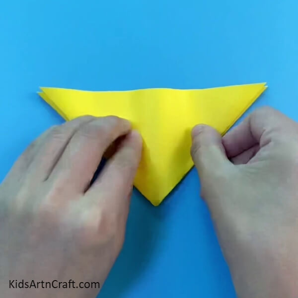 Starting Folding the Upper Triangle- A Guide to Creating a Simple Paper Hen Craft For Beginners 