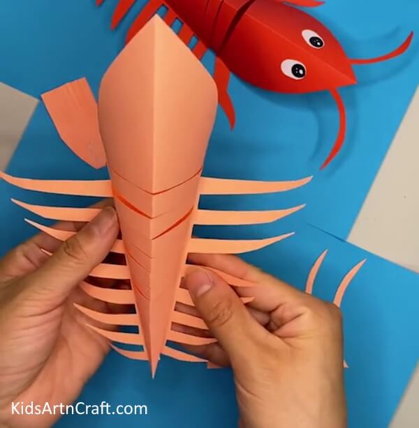 Pasting the Legs on the Lobster- A Tutorial on Making a Paper Lobster Craft for Kids 