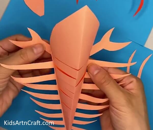 Pasting the Claws on the Lobster- Easy Instructions for a Kid-Friendly Paper Lobster Craft