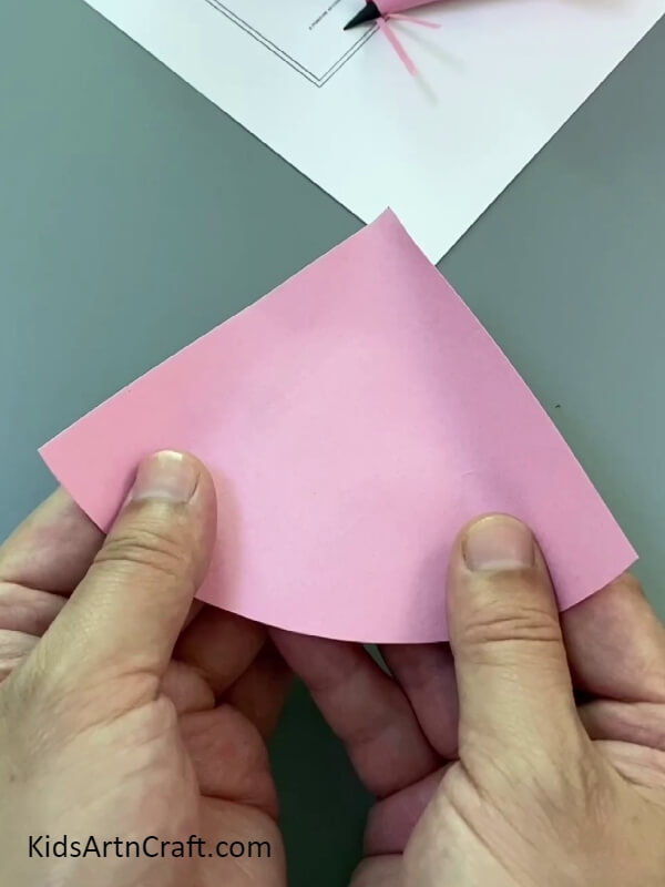Folding the paper- Crafting a paper mouse finger puppet is a piece of cake for newcomers.