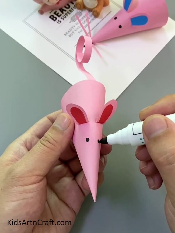 Making eyes of the mouse- A tutorial on making a paper mouse finger puppet is perfect for beginners.