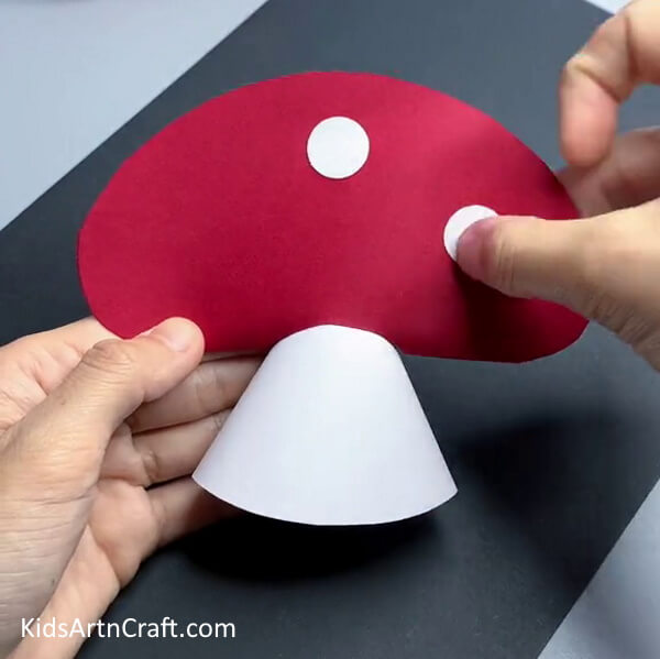Pasting Circle Over The Crown - Crafting a paper mushroom - a guide for kids, step-by-step