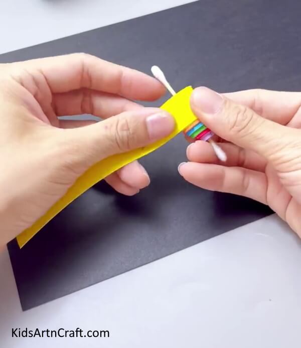 Wrapping Strips Around One Another - It can be a great time making a paper-based spinning toy craft for kids.
