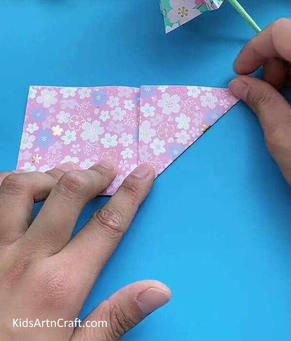 Making a Triangle By Folding Printed Craft Paper-Guide To Crafting A Paper Umbrella For Little Ones