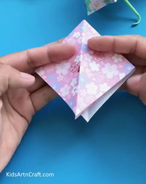 Fold The Triangle To Make a Diamond Shape-Crafting A Paper Umbrella - A Guide For Kids