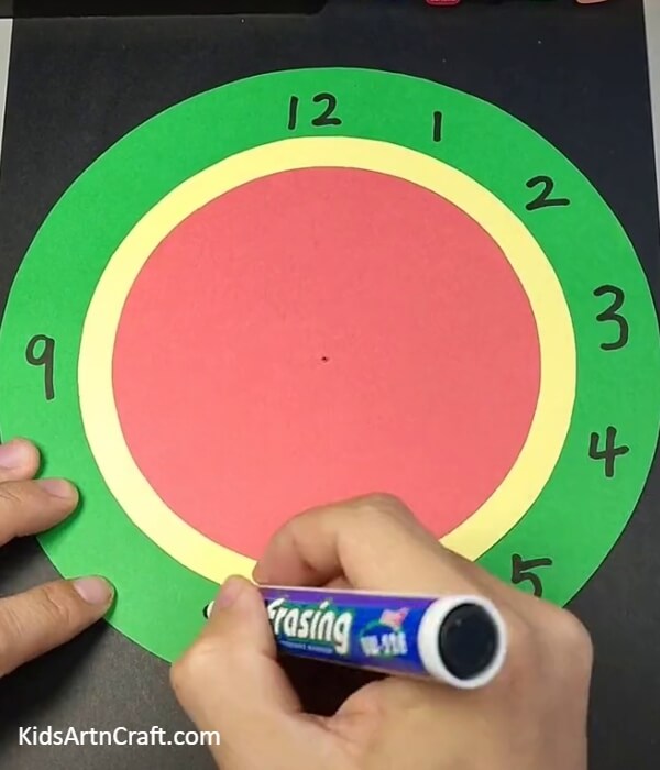 Writing The Numbers On The Clock-Construct a Paper Watermelon Clock with the help of children
