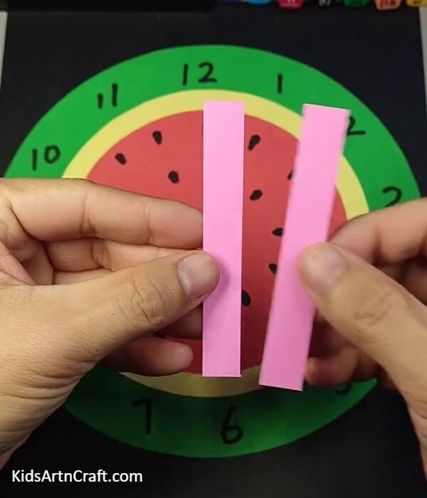 Making The Arms Of The Clock-A Watermelon Clock made of paper, is a great activity for kids