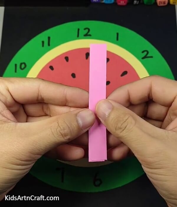 Placing The Strips On Top Of One Another-Crafting a Paper Watermelon Clock for youngsters