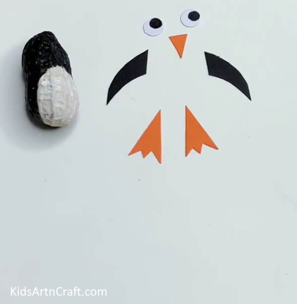 Making The Body Parts - A marvelous penguin craft composed of peanut, styrofoam, and a paintbrush.