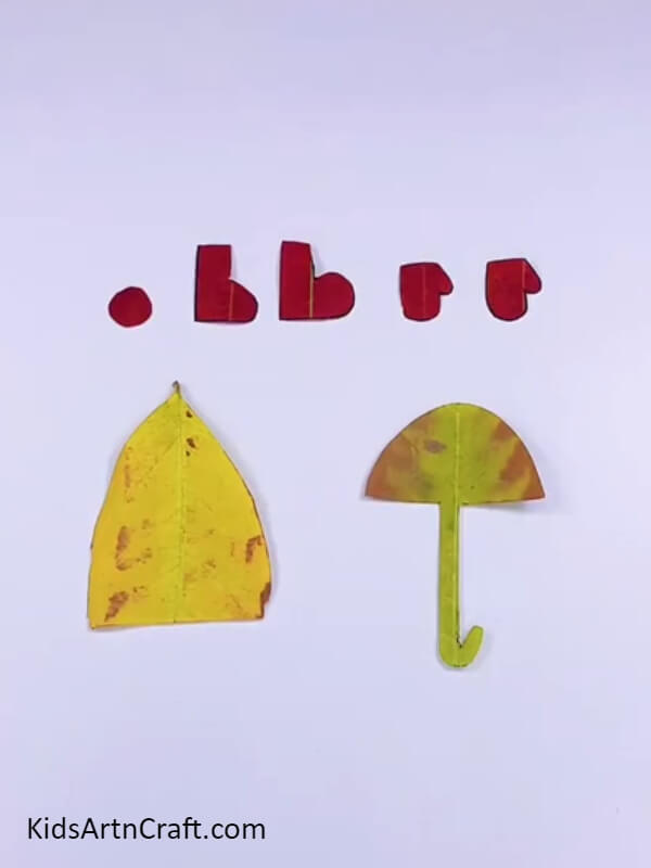 Cutting out all the shapes drawn on the leaves- Crafting ideas for a rainy day for children 