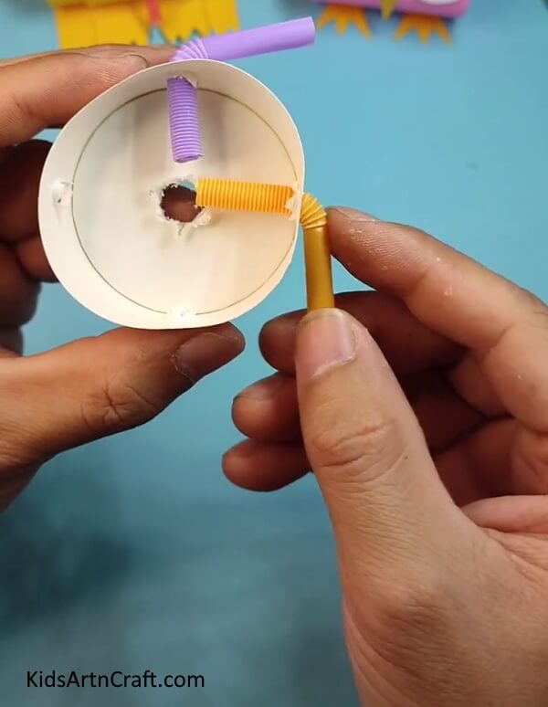 Inserting Straws In Hole A fun, simple toy for kids - DIY a spinner with a cup and straws!
