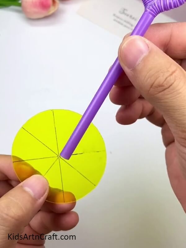 Stick the Bubble Blower to the Circular Plastic Surface- Make a Bubble Blower Easily with a Straw and Follow this Tutorial
