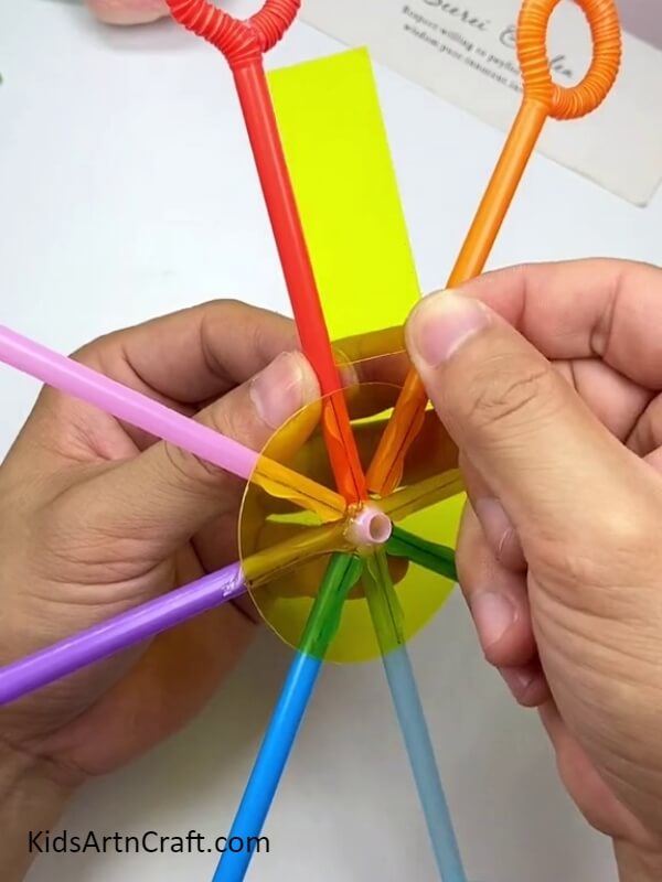 Stick Rectangular Bits of Plastic Paper to the Bubble Blowers- Create a Bubble Blower by Following this DIY Tutorial with a Straw