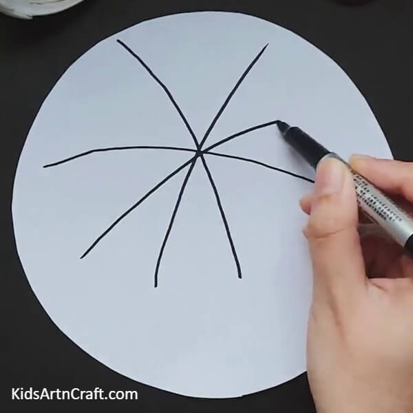 Draw an asterisk on a white paper-A Simple Spider Web Craft For Kids