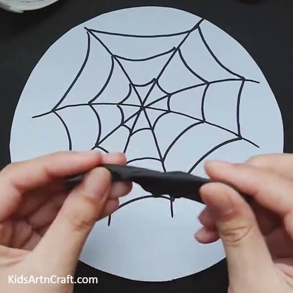 take black clay-A Fun And Simple Spider Web Creation For Children