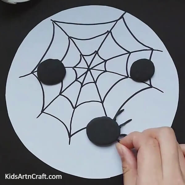 Make legs for spider from clay-A Quick And Easy Spider Web Art For Kids To Create