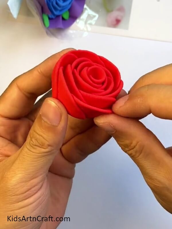 Completing The Rose Shape-Constructing a Clay Rose Bouquet is an effortless task for young ones