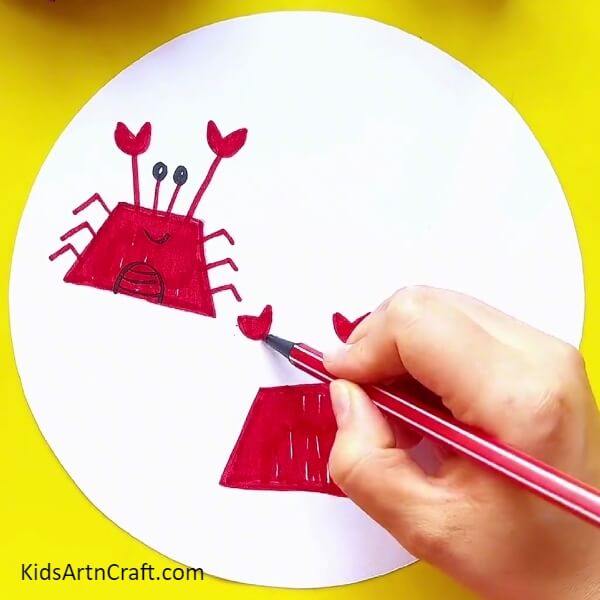 Making claw of the crab with red sketch pen- How to Draw a Crab with a Sketch Pen Easily Step-by-Step 