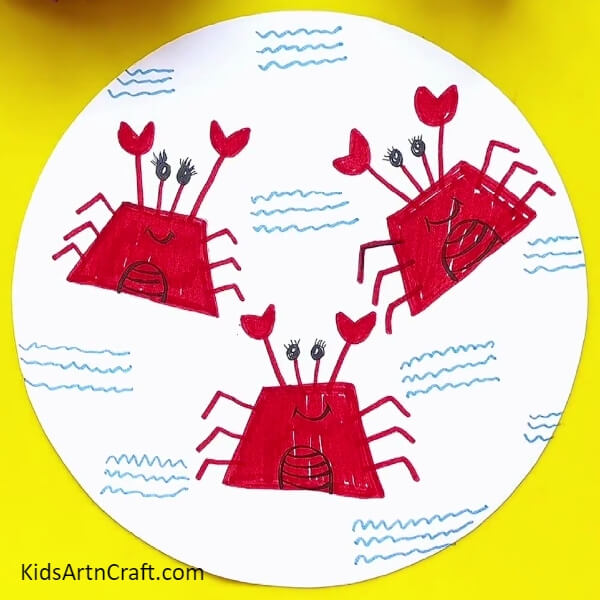After drawing the water and crabs our cute crabs drawing is ready- A Comprehensive Tutorial for Drawing a Crab Using a Sketch Pen 