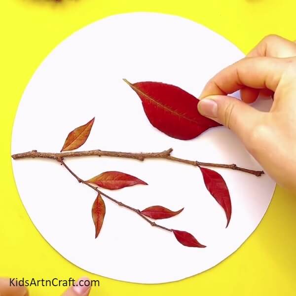 Pasting More Leaves On The Sheet-Making A Fall Leaves Bird Craft With Kids: A Step-By-Step Tutorial 