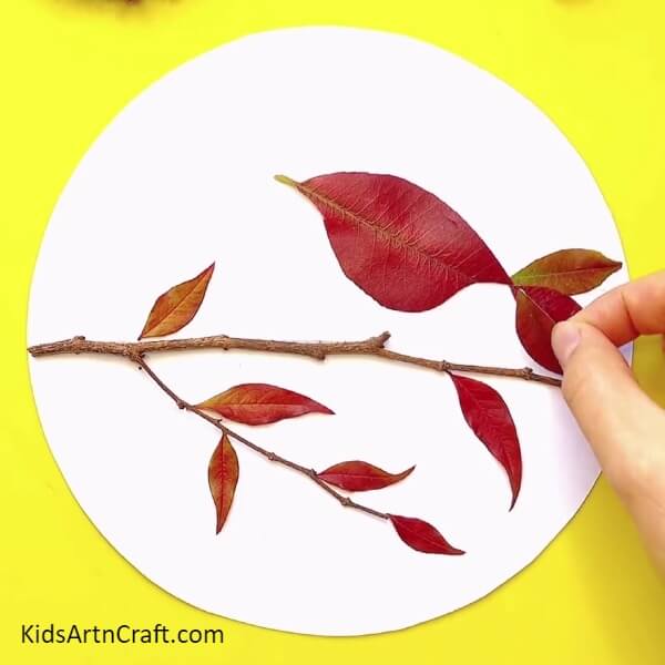 Pasting More Small Leaves-An Easy To Follow Tutorial For Creating A Fall Leaves Bird Craft With Kids 