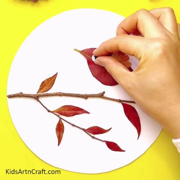 Pasting The Googly Eye-A Fun And Easy Fall Leaves Bird Craft Activity For Children 