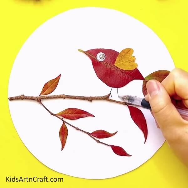 Adding A Pair Of Legs To The Bird-A Step-By-Step Guide To Making A Fall Leaves Bird Craft With Kids 