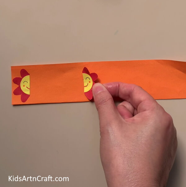 Pasting Flowers On An Orange Strip - Incredible Flower Paper Rings Jewelry Work For Children To Assemble At Home