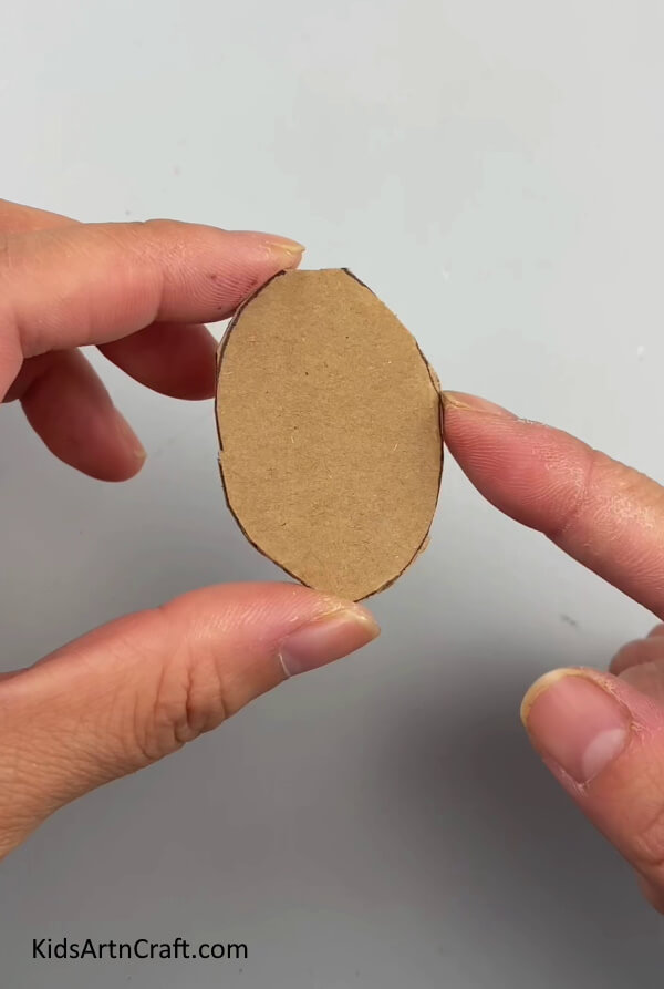 Cutting The Small Rectangle Into An Oval Shape - How To Easily Construct A Football Symbol