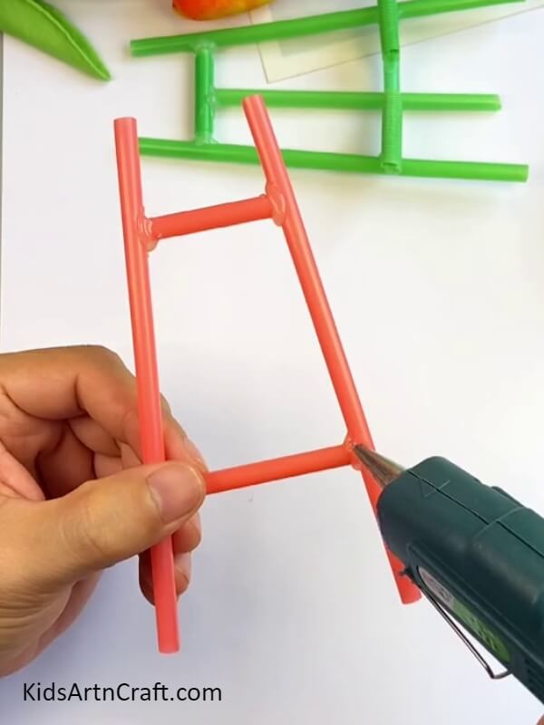 Pasting The Pieces Together-Crafting a DIY Mobile Phone Holder With Straws: an Easy Tutorial for Children 