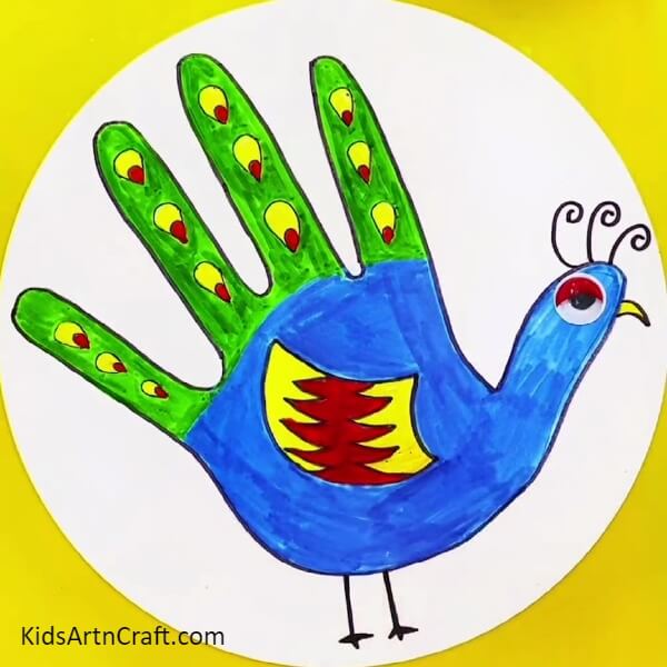 Wohooo!! Your elegant peacock is finally completed- A Step-by-Step Guide to Crafting a Peacock Outline with Palms for Kids