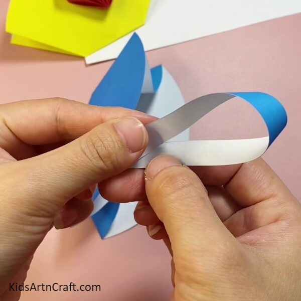 Take A Blue Craft Paper Strip And Join The Ends With Glue-Paper Bag Craft Tutorial For Kids