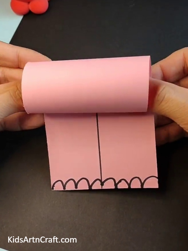 Pasting the edge of pink paper- Fun Paper Elephant Creations For Kids To Make 