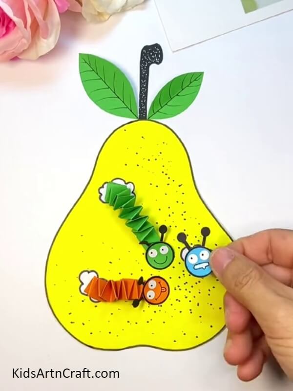 Sticking All The Worms In The Holes - An Easy Pear-Fruit Worm Craft Tutorial For Kids To Create 
