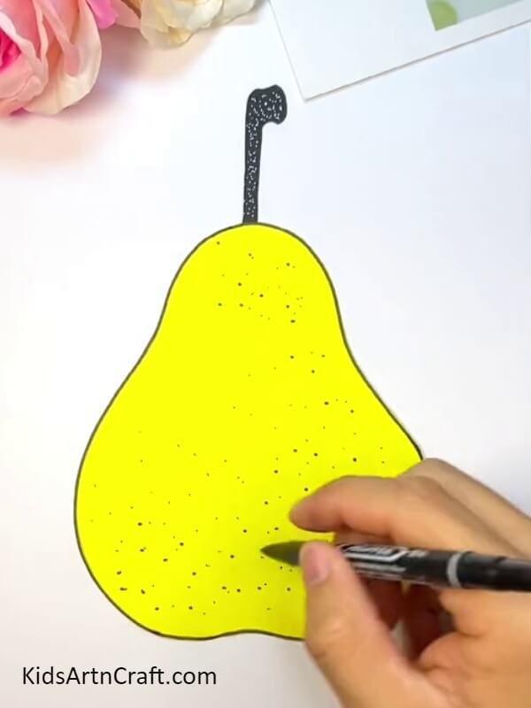 Make Dots In The Stem With Marker And Pear With Black Sketch Pen - Crafting a Pear-Fruit Worm With Kids - An Easy Tutorial