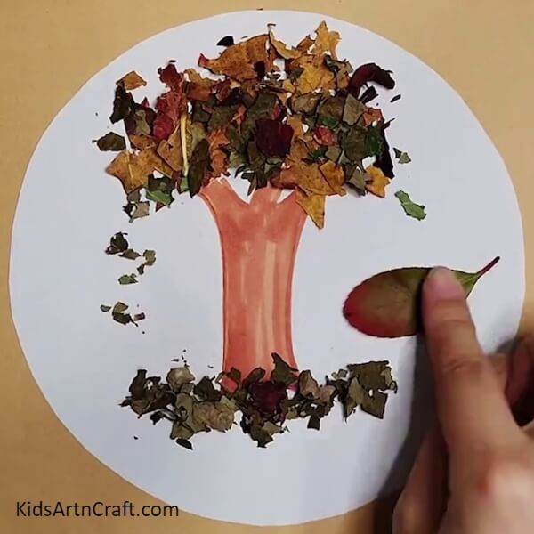 Creating a Creature Beside the Trunk- Directions on Building a Tree Using Leaves From Fall 
