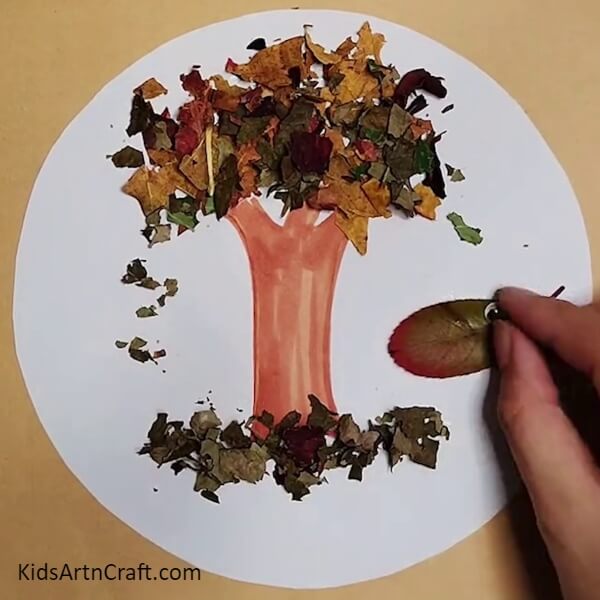 Adding Googly Eyes- Tutorial on How to Make a Tree Out of Leaves From Autumn 