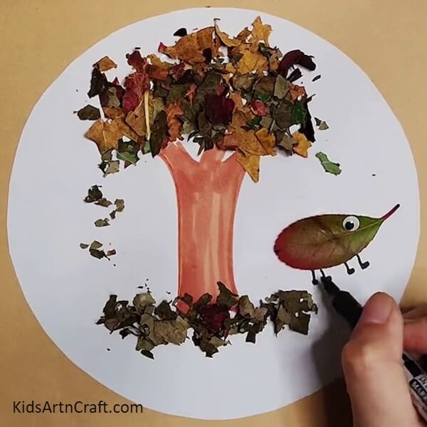 definition to the creature we created- Learn How to Make a Tree Shape Utilizing Leaves From Fall 
