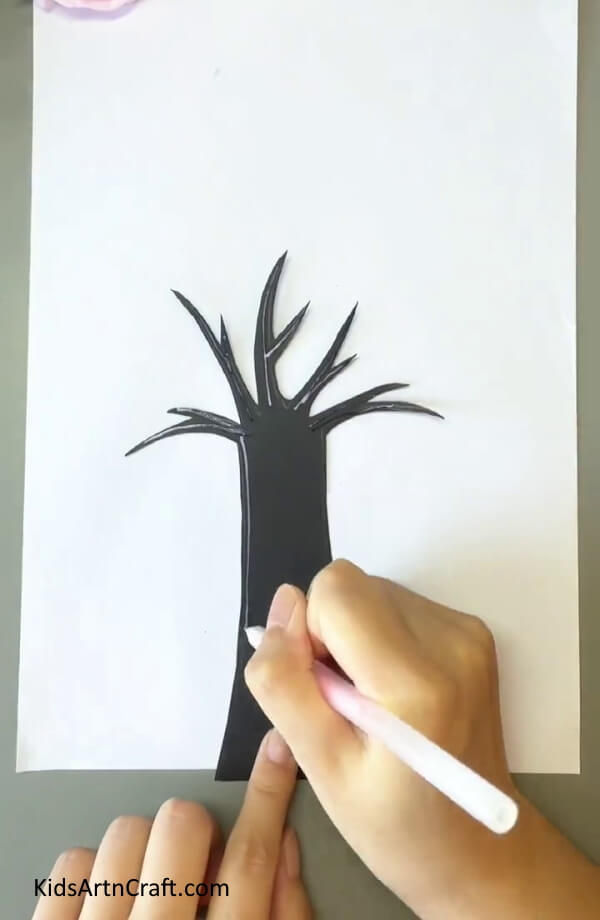 Applying Glue Over The Tree-Earbuds enable children to make a tree painting without difficulty
