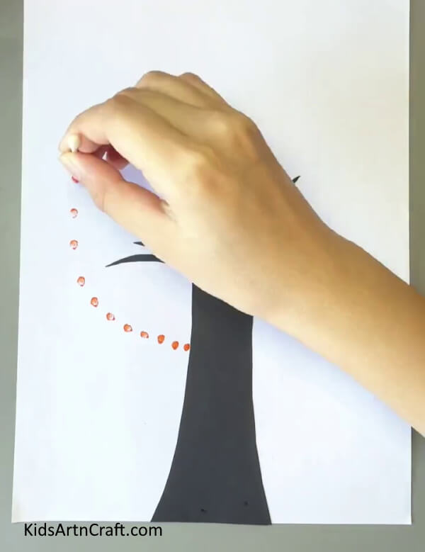 Making Orange Leaves - Earbuds can be used by kids for straightforward painting