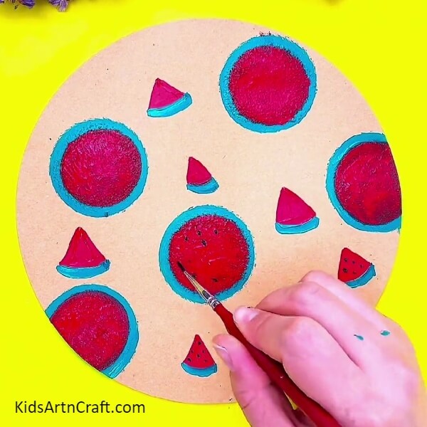 Making Seeds Of The Watermelon With Black Paint Colour-A Comprehensive Guide to Making a Watermelon Stamp Doodle Painting