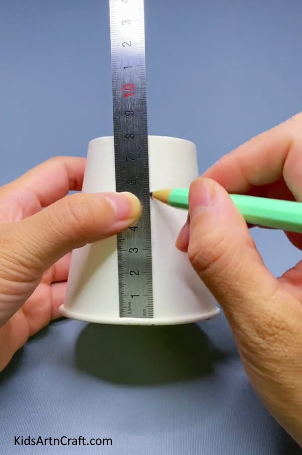 Make a Line With a Pencil And Ruler-A Simple Windmill Fan Toy Craft For Kids Utilizing a Paper Cup
