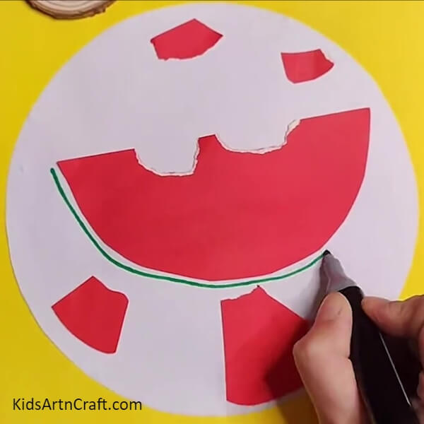 Drawing outer layer of watermelon- An Artistic Adventure – Watermelon Ants and Children