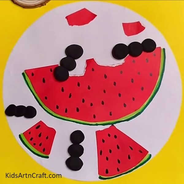 Pasting more ants- Creative Crafting with Watermelon Ants – A Kids’ Activity