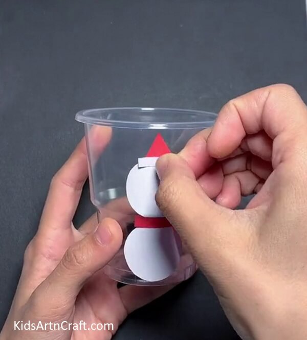 Adding Hat On The Snowman - Construct a Snowman That Changes Emotions Utilizing a Disposable Glass - It's Fun!