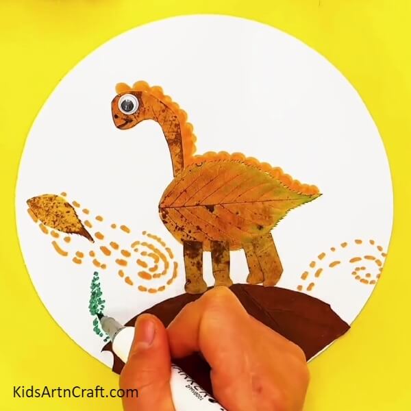 Make plants with green marker/sketch pen- How to Create a Dinosaur Landscape with Fallen Leaves for Kids