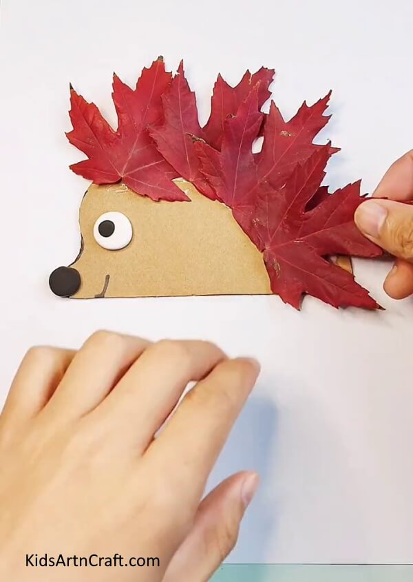 Pasting All The Leaves In An Order- Autumn Leaves Enjoyable Hedgehog Creation Guide For Youngsters 