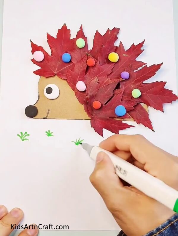 Drawing Some Grass Using Green Sketch Pen- Fallen Leaves Entertaining Hedgehog Crafting Plan For Kids 
