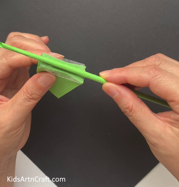Sticking The Quarters On The Stick - Kids' Art and Craft - Making a Frog-Shaped Paper Umbrella 